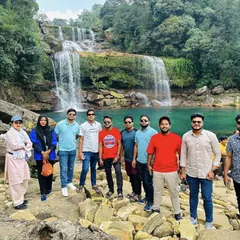 The team beside the turquoise pool at Dawki